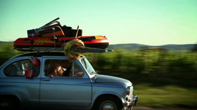 https://www.corewalking.com/wp-content/uploads/2014/07/stock-footage-family-driving-in-a-small-car-toward-summer-holiday-on-beach.jpg